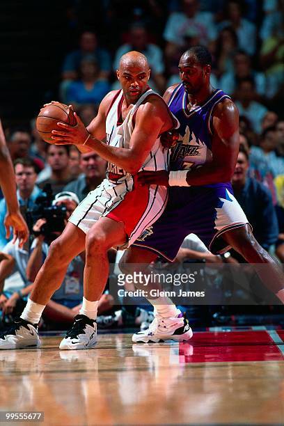 Charles Barkley of the Houston Rockets looks to make a move against Karl Malone of the Utah Jazz in Game Four of the Western Conference Finals during...
