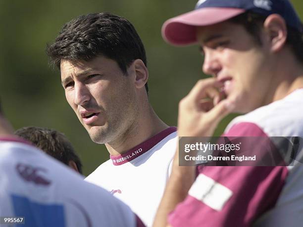 John Eales of the Queensland Reds talks to his team mates during Queensland Reds training for their match against the British Lions on Saturday. The...