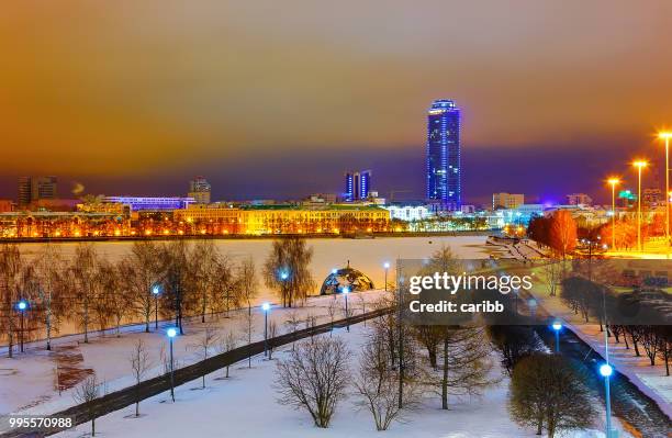 winter evening on the embankment the city of yekaterinburg - yekaterinburg stock pictures, royalty-free photos & images