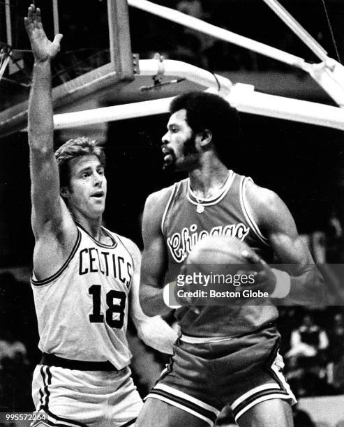 Boston Celtics' Dave Cowens guards Chicago's Artis Gilmore during the third quarter. The Boston Celtics host the Chicago Bulls in a regular season...