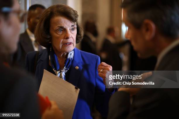 Senate Judiciary Committee ranking member Sen. Dianne Feinstein talks with staff members outside the Senate chamber in the U.S. Capitol July 10, 2018...