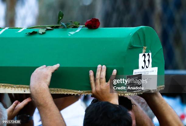 Bosnians carry the coffins of the 35 Srebrenica victims to the Potocari Monument Cemetery to pay respect during the 23rd anniversary of the massacre...