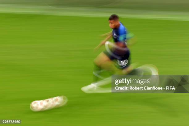 Kylian Mbappe of France runs with the ball during the 2018 FIFA World Cup Russia Semi Final match between Belgium and France at Saint Petersburg...