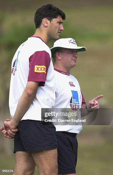 John Eales and Mark McBain of the Queensland Reds talk tactics during Queensland Reds training for their match against the British Lions on Saturday....