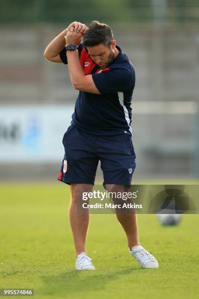 Bristol City manager Lee Johnson practices his golf swing during the Pre-Season Friendly between Bristol City v Cheltenham Town on July 10, 2018 in...