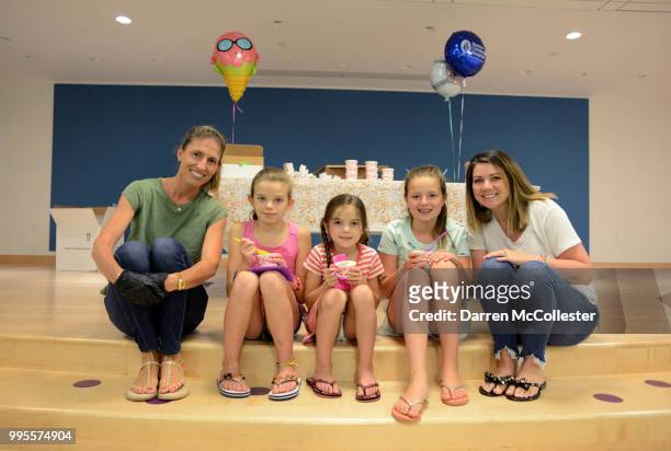 Kelli Pedroia and Lakyn Holt sit with Amelia, Abigail, and Adalee during an ice cream party for the kids at Boston Children's Hospital July 10, 2018...