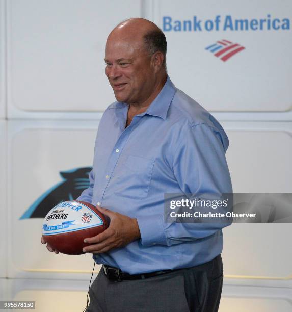 Billionaire hedge-fund manager David Tepper, the new owner of the Carolina Panthers, poses for photos at the conclusion of his introductory press...