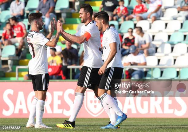 Benfica defender Jardel from Brazil celebrates with teammates after scoring a goal during the Pre-Season Friendly match between SL Benfica and FK...