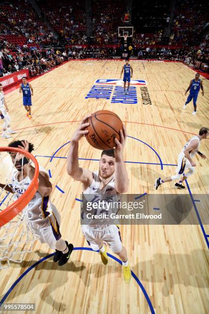 Svi Mykhailiuk of the Los Angeles Lakers rebounds the ball against the the Philadelphia 76ers during the 2018 Las Vegas Summer League on July 7, 2018...