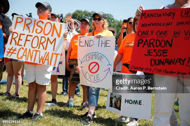 July 10: Protesters hold signs during a rally calling for criminal justice reform outside the U.S. Capitol July 10, 2018 in Washington, DC....