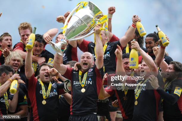 Captain Steve Borthwick of Saracens leads the victory celebrations following the AVIVA Premiership Final between Leicester Tigers and Saracens at...