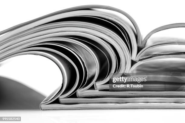stack of magazines on white background with reflection - advertising column stock pictures, royalty-free photos & images