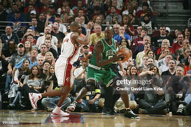 Kevin Garnett of the Boston Celtics looks to move the ball around Antawn Jamison of the Cleveland Cavaliers in Game One of the Eastern Conference...