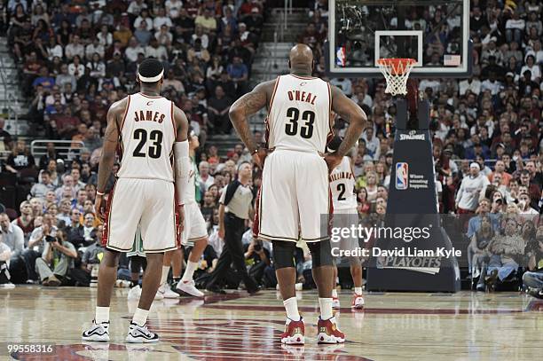 LeBron James and Shaquille O'Neal of the Cleveland Cavaliers stand oncourt against the Boston Celtics in Game One of the Eastern Conference...