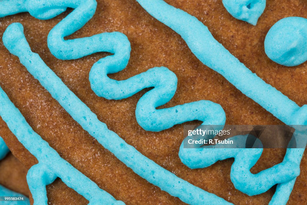 Blue glaze gingerbread cookie close up shot