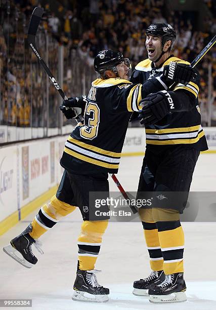 Michael Ryder of the Boston Bruins celebrates his goal with teammate Zdeno Chara in the first period against the Philadelphia Flyers in Game Seven of...