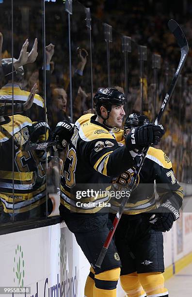 Zdeno Chara of the Boston Bruins congratulates Michael Ryder after Ryder scored a goal in the first period against the Philadelphia Flyers in Game...