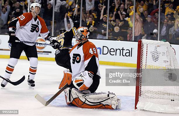 Michael Leighton and Chris Pronger of the Philadelphia Flyers react after the Boston Bruins' Milan Lucic's goal in Game Seven of the Eastern...