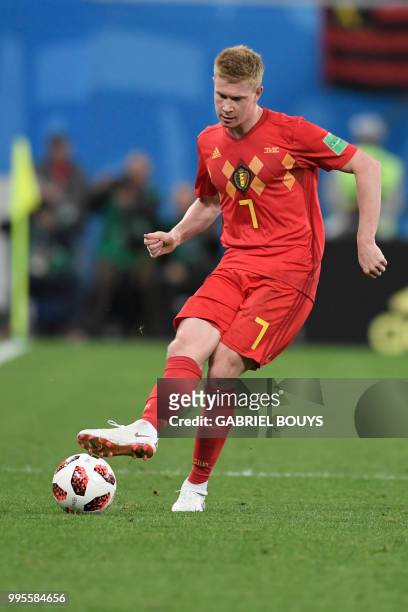 Belgium's midfielder Kevin De Bruyne passes the ball during the Russia 2018 World Cup semi-final football match between France and Belgium at the...