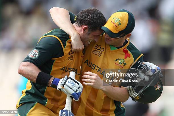 Michael Hussey of Australia celebrates with Michael Clarke after the ICC World Twenty20 semi final between Australia and Pakistan at the Beausjour...