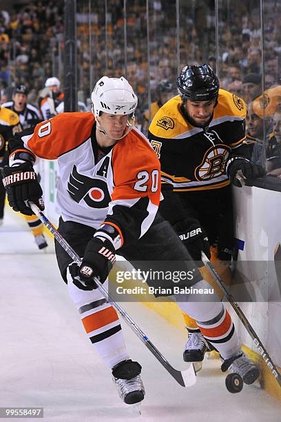 Chris Pronger of the Philadelphia Flyers skates after the puck against Milan Lucic of the Boston Bruins in Game Seven of the Eastern Conference...