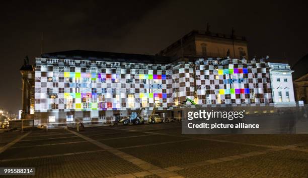 The restored building of the Staatsoper Unter den Linden is illuminated during a rehearsal for the Festival of Lights in Berlin, Germany, 26...