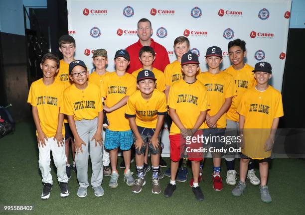 Todd Frazier and members of the Greenwich Village Little League at the Canon #PIXMAPerfect Grand Slam event at New York Empire Baseball on July 10,...