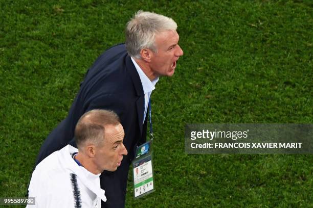 France's coach Didier Deschamps reacts during the Russia 2018 World Cup semi-final football match between France and Belgium at the Saint Petersburg...