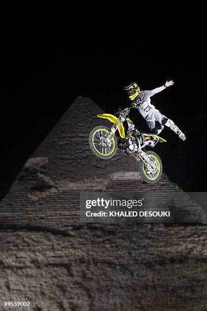 Freestyle biker jumps in front of the Giza pyramids during the second stage of the freestyle motocross Red Bull X-Fighters World Tour on the...