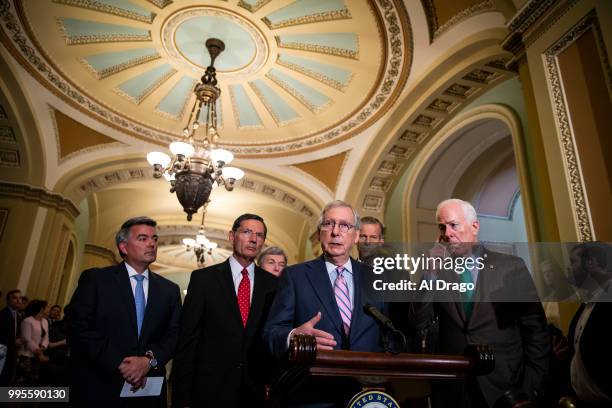 Senate Majority Leader Mitch McConnell speaks with fellow Senate Republicans during a news conference following the weekly Senate Republicans policy...