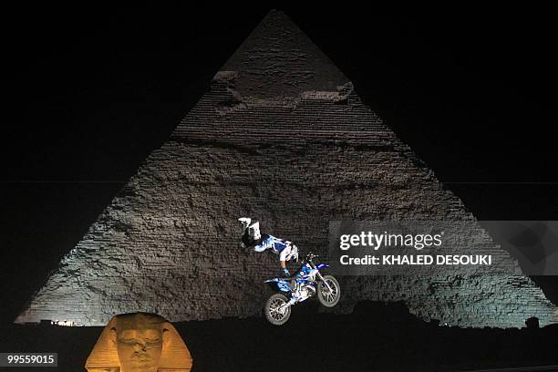 Freestyle biker jumps in front of the Sphinx and Giza pyramids during the second stage of the freestyle motocross Red Bull X-Fighters World Tour on...