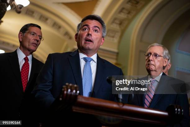 Sen. Cory Gardner speaks beside Sen. John Thune , left, and Senate Majority Leader Mitch McConnell , right, during a news conference following the...