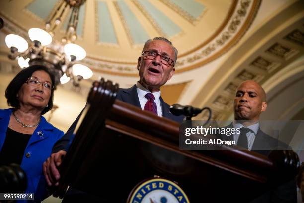 Senate Minority Leader Chuck Schumer gives remarks alongside fellow Senate Democrats Sen. Mazie Hirono and Sen. Cory Booker during a news conference...