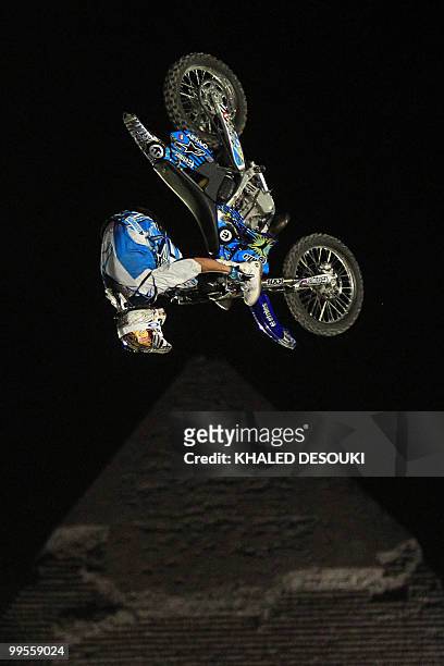 Freestyle biker jumps in front of the Giza pyramids during the second stage of the freestyle motocross Red Bull X-Fighters World Tour on the...