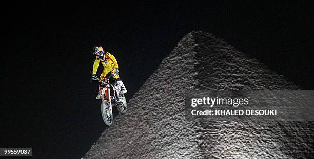 Freestyle biker jumps in front of the Giza pyramids during the second stage of the freestyle motocross Red Bull X-Fighters World Tour on the...