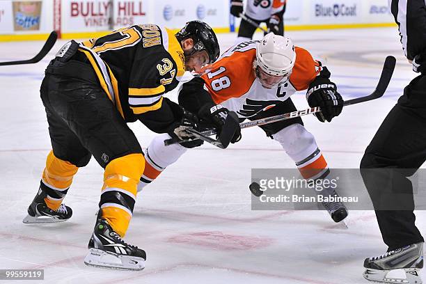 Patrice Bergeron of the Boston Bruins faces-off against Mike Richards of the Philadelphia Flyers in Game Seven of the Eastern Conference Semifinals...