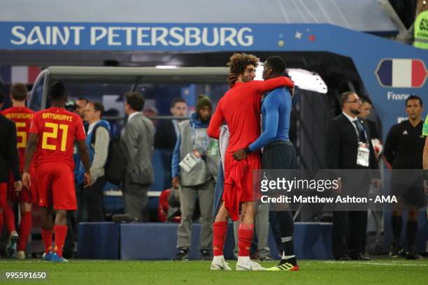 Manchester United teammates Marouane Fellaini of Belgium and Paul Pogba of France at full time during the 2018 FIFA World Cup Russia Semi Final match...
