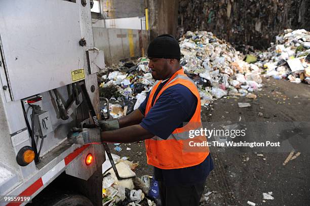 Harold Taylor, a Fairfax County employee, finishes dumping trash at the COVANTA Fairfax Energy/Resource Recovery Facility on May 14 in Lorton, VA....