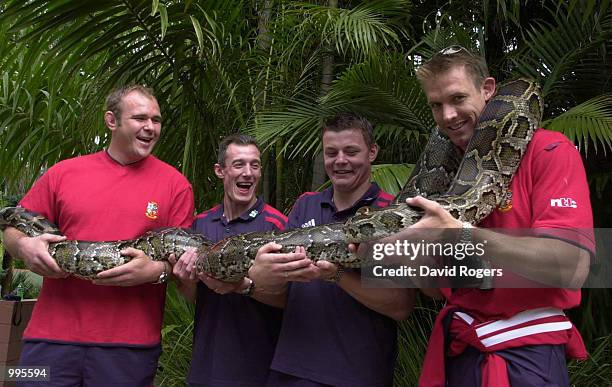 Scott Quinnell, Rob Howley, Brian O''Driscoll and Daffyd James of the British and Irish Lions pose with a 50kg Burmese Python during a team trip to...