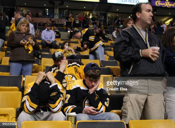 Boston Bruins fans react after their team lost to the Philadelphia Flyers in Game Seven of the Eastern Conference Semifinals during the 2010 NHL...