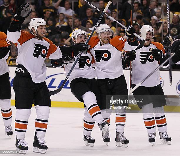 Daniel Carcillo, Danny Briere, Claude Giroux and Matt Carle of the Philadelphia Flyers celebrate the win over the Boston Bruins in Game Seven of the...