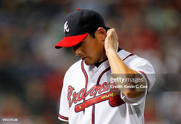 Starting pitcher Kenshin Kawakami of the Atlanta Braves walks to the dugout after getting pulled against the Arizona Diamondbacks at Turner Field on...