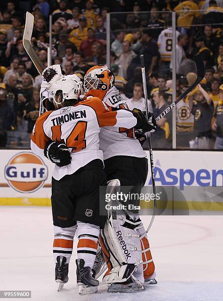 Kimmo Timonen and Mike Richards of the Philadelphia Flyers celebrates the win with goalie Michael Leighton after defeated the Boston Bruins in Game...