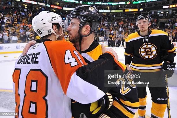 Mark Recchi of the Boston Bruins hugs Danny Briere of the Philadelphia Flyers after Game Seven of the Eastern Conference Semifinals during the 2010...