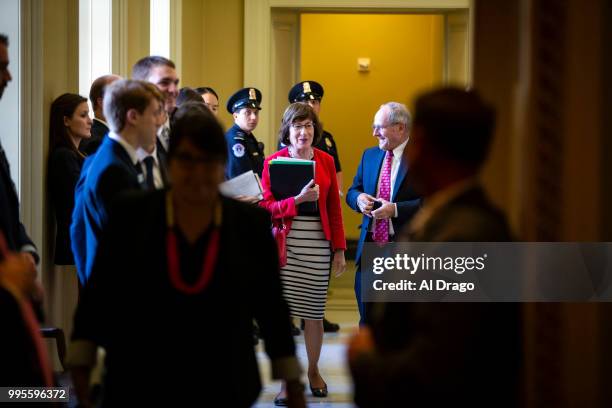 Sen. Susan Collins arrives with Sen. Jim Risch for the weekly Senate Republicans policy luncheon, on Capitol Hill, on July 10, 2018 in Washington,...
