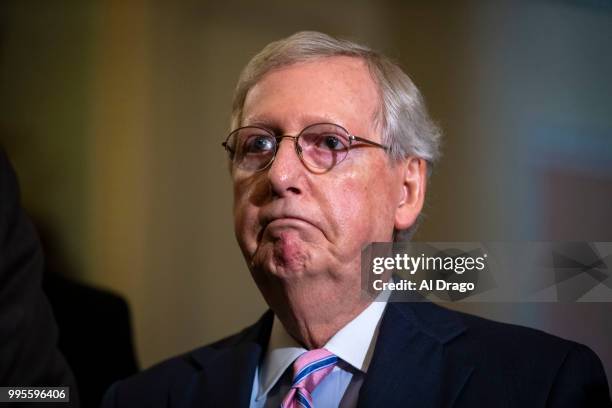 Senate Majority Leader Mitch McConnell speaks with fellow Senate Republicans during a news conference following the weekly Senate Republicans policy...