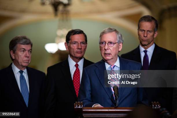 Senate Majority Leader Mitch McConnell speaks with fellow Senate Republicans during a news conference following the weekly Senate Republicans policy...