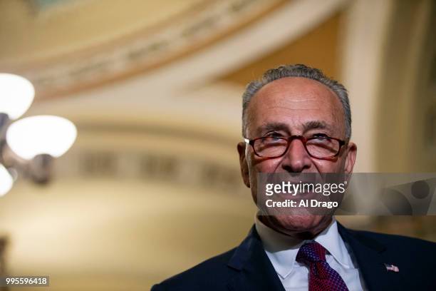 Senate Minority Leader Chuck Schumer speaks with fellow Senate Democrats during a news conference following the weekly Senate Democrats policy...