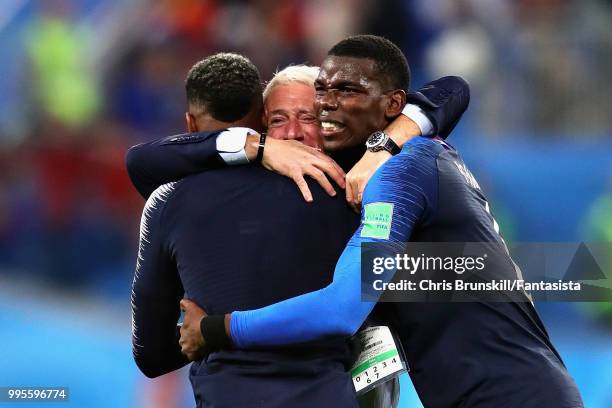 Head Coach of France Didier Deschamps celebrates with Paul Pogba and Presnel Kimpembe both of France after the 2018 FIFA World Cup Russia Semi Final...