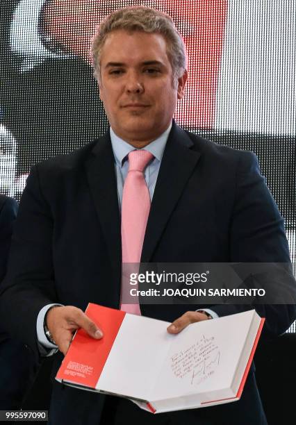 Colombian President-elect Ivan Duque poses during the presentation of his book "Arqueologia de mi Padre" in Medellin, Antioquia department, Colombia...